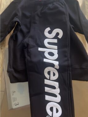 Supreme Black Sweatpants with White Vertical Logo Panel